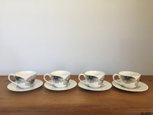Load image into Gallery viewer, Black and white tea cups and saucers