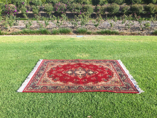 Red rug with fringe - 120cm x 165cm